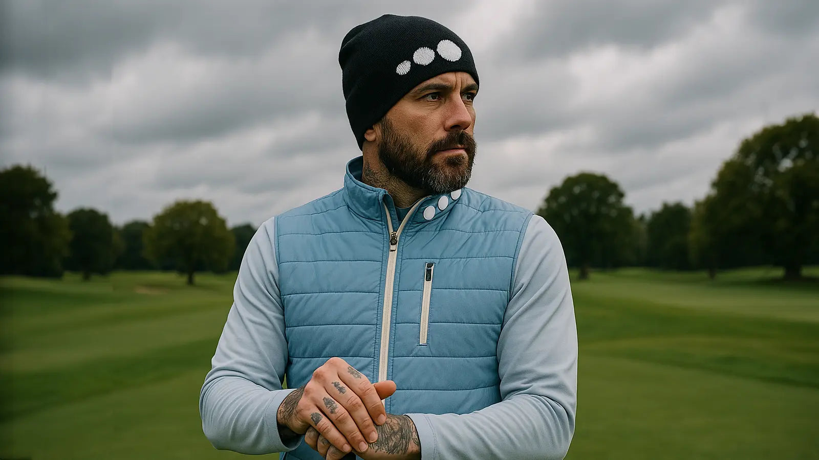 Storm Golfer in Blue Hybrid Coat and Black Beanie